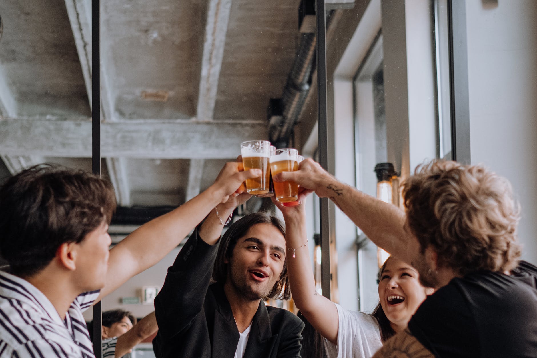 group of young people making a toast